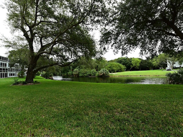 1035 Newport H, Deerfield Beach, FL 33442 - view of grassy yard featuring a water view