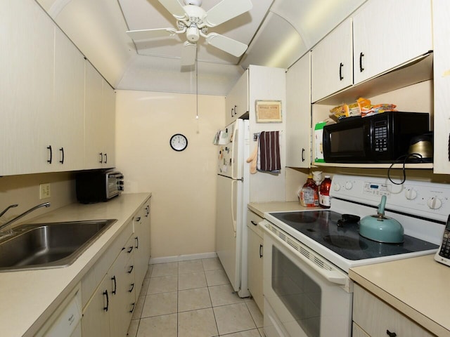 kitchen with ceiling fan, sink, light tile patterned floors, and white appliances