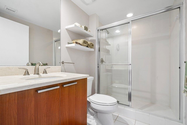 bathroom with toilet, an enclosed shower, vanity, and tile patterned floors