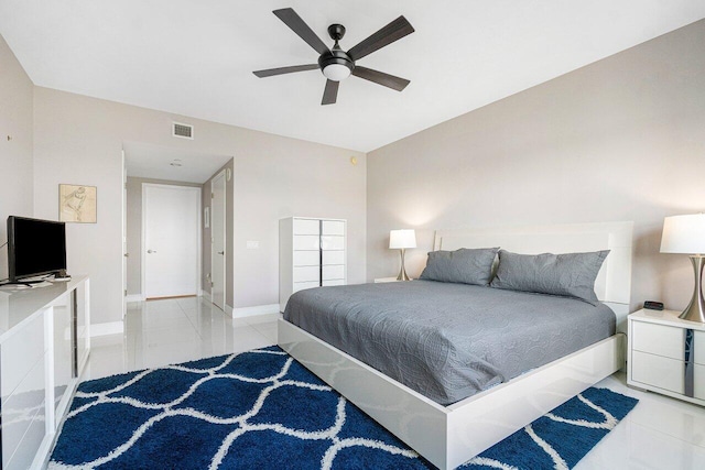 bedroom featuring light tile patterned flooring and ceiling fan