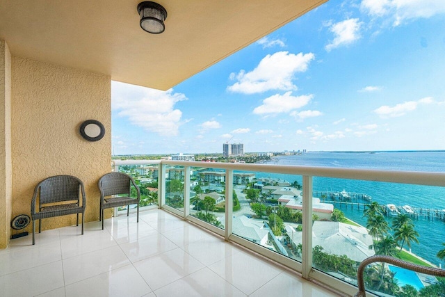 balcony featuring a water view