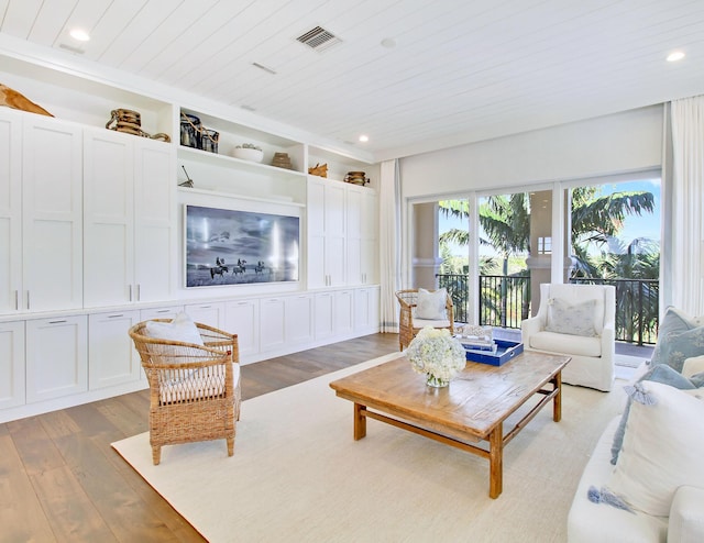 living room featuring wood ceiling and hardwood / wood-style flooring