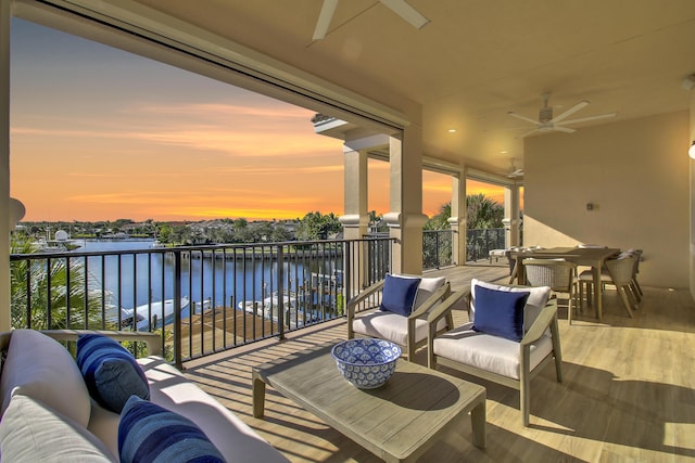 exterior space with a water view and ceiling fan