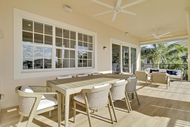 sunroom featuring ceiling fan