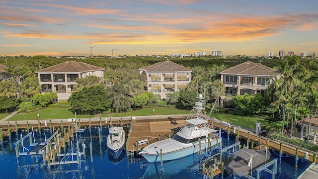 aerial view at dusk with a water view