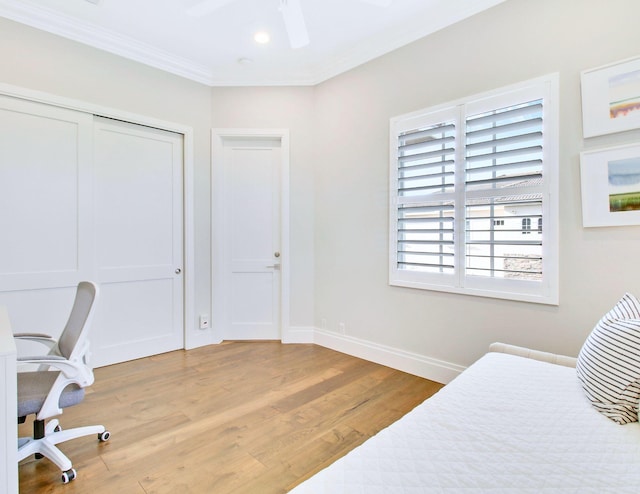 bedroom with ceiling fan, ornamental molding, and light wood-type flooring