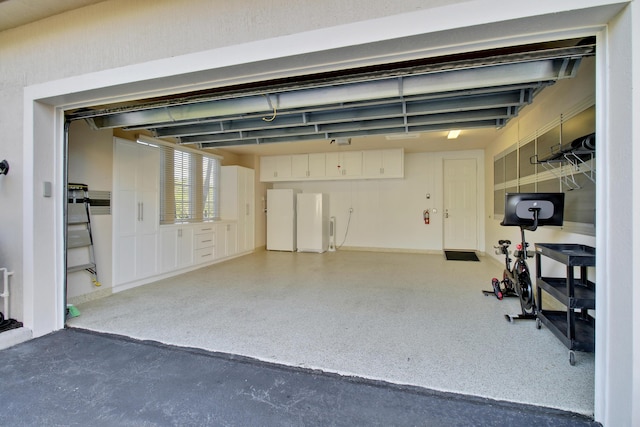 garage with white refrigerator