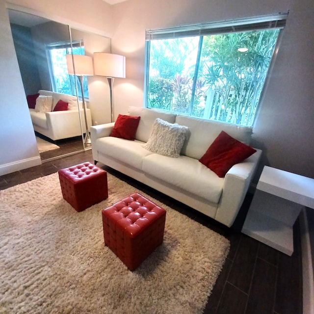 living area featuring baseboards