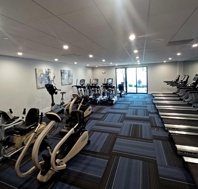 workout area featuring carpet and recessed lighting