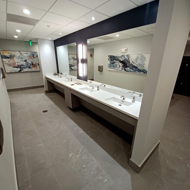 bathroom with vanity and a drop ceiling