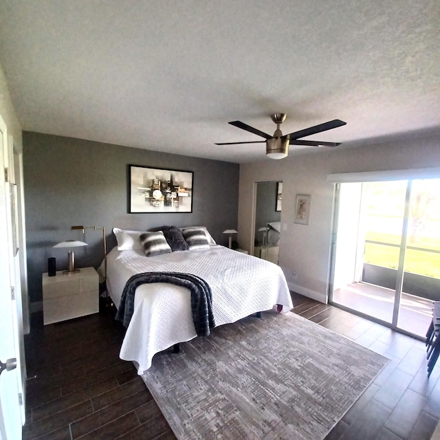 bedroom with a textured ceiling, ceiling fan, baseboards, and wood tiled floor