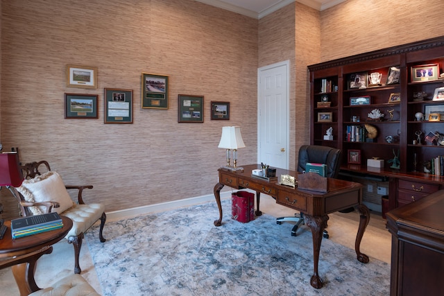 carpeted home office featuring crown molding