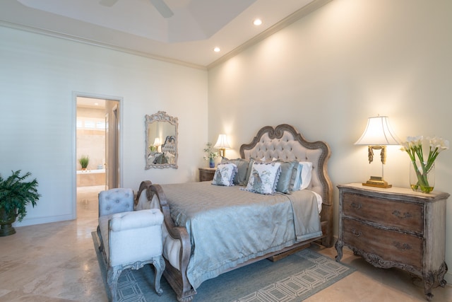 bedroom featuring ornamental molding, ceiling fan, and ensuite bath