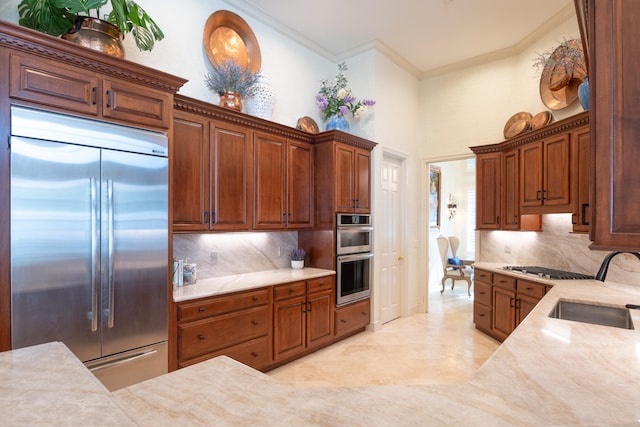 kitchen with sink, crown molding, stainless steel appliances, and backsplash