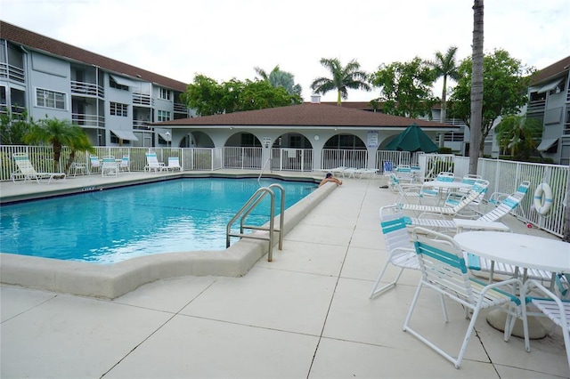 view of swimming pool featuring a patio