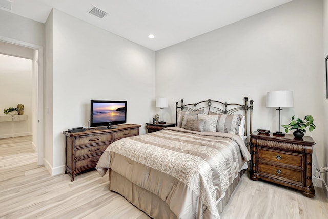 bedroom with light hardwood / wood-style flooring