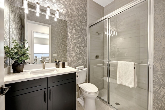 bathroom with toilet, an enclosed shower, vanity, and tile patterned flooring