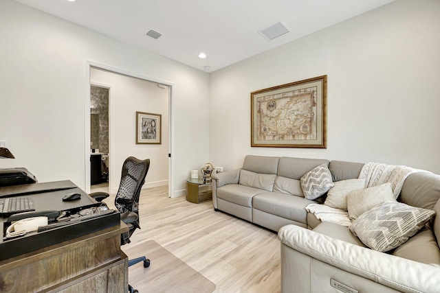 home office with light wood-type flooring