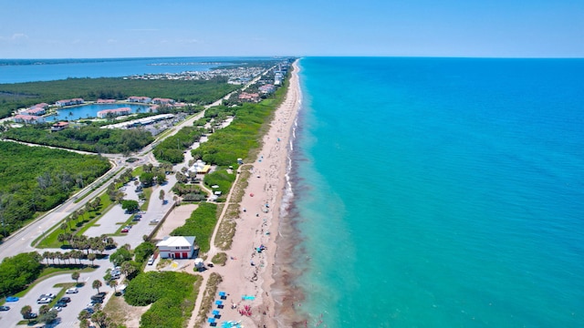 aerial view featuring a water view and a beach view