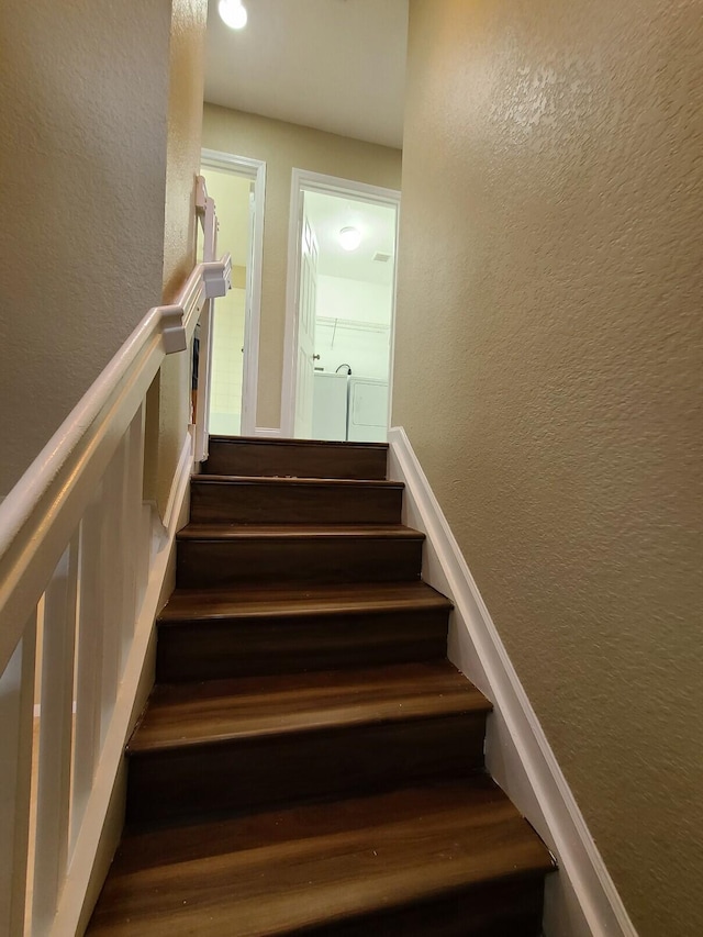 stairs with hardwood / wood-style floors