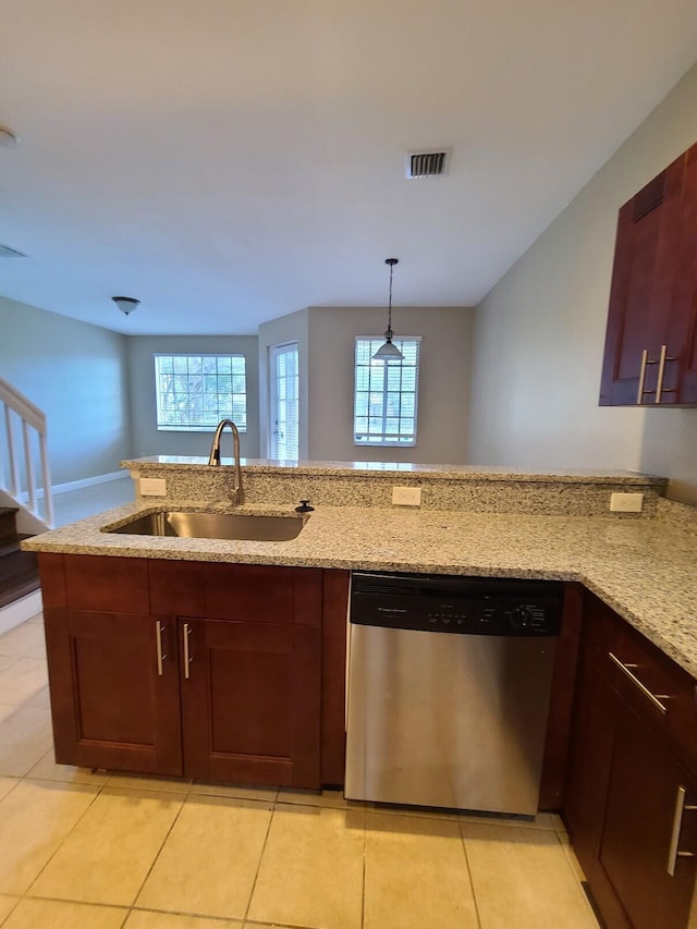 kitchen with dishwasher, a healthy amount of sunlight, sink, and light stone counters