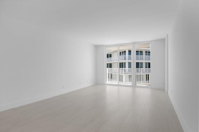 unfurnished room featuring light wood-type flooring