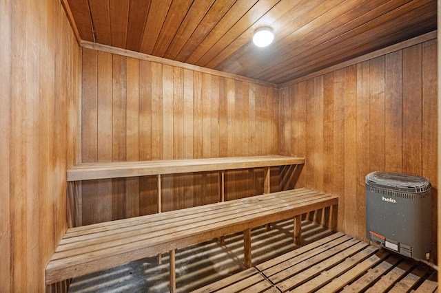 view of sauna featuring wood walls and wooden ceiling