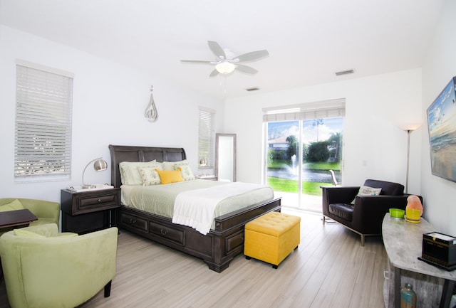 bedroom featuring access to outside, ceiling fan, and light hardwood / wood-style floors