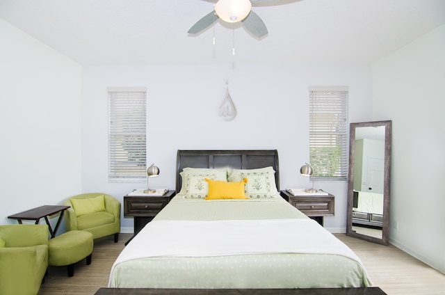 bedroom featuring ceiling fan and light hardwood / wood-style flooring