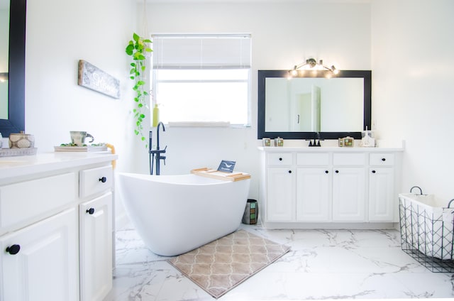 bathroom featuring vanity and a bathing tub