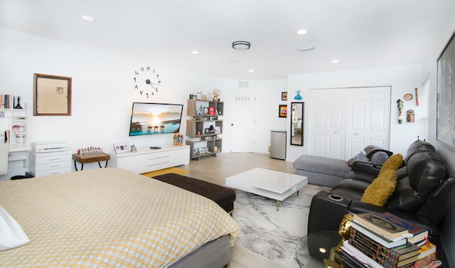 bedroom featuring a closet and light hardwood / wood-style floors