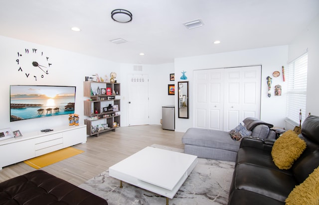 living room with light hardwood / wood-style flooring