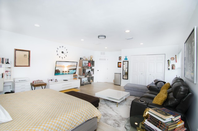 bedroom featuring a closet and light hardwood / wood-style floors