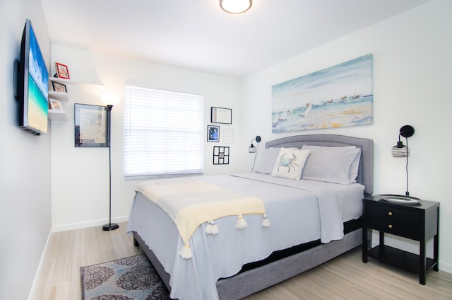 bedroom with light hardwood / wood-style floors