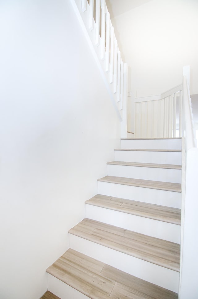 stairway featuring hardwood / wood-style floors