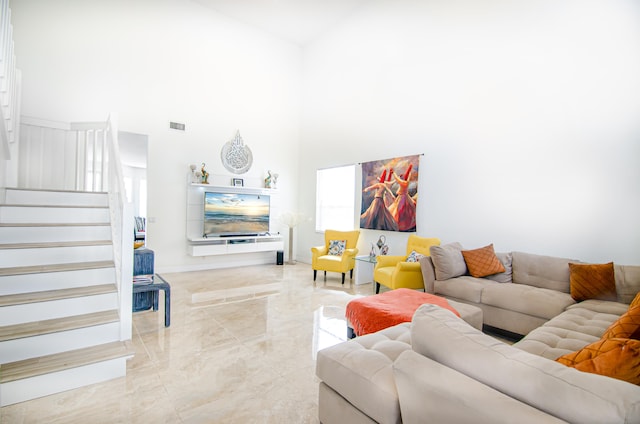 living room featuring high vaulted ceiling