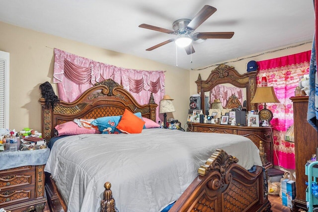 bedroom featuring hardwood / wood-style floors and ceiling fan