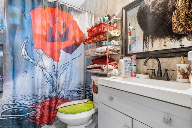 bathroom with vanity, a shower with curtain, and toilet