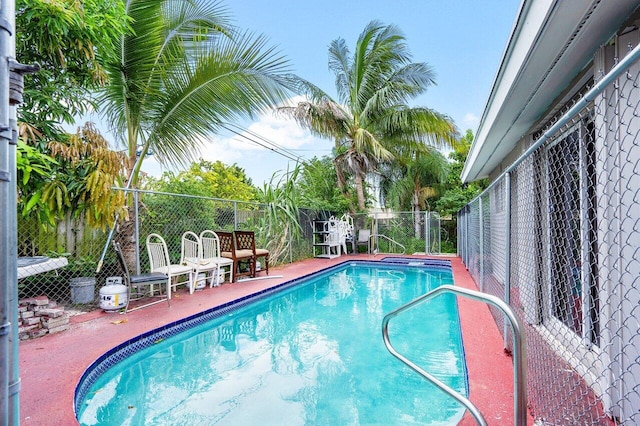 view of swimming pool with a patio area