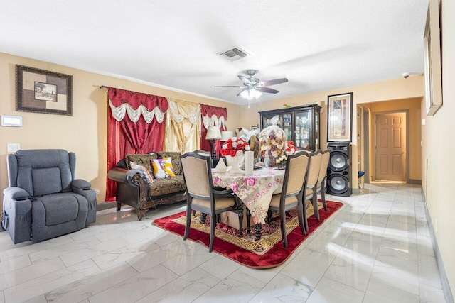 dining space featuring ceiling fan