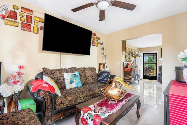 living room featuring ceiling fan