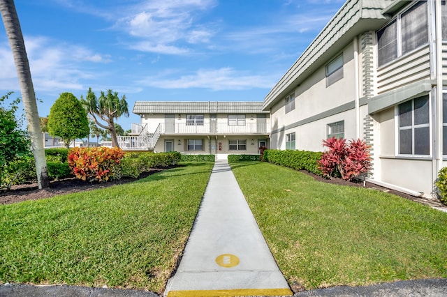 surrounding community featuring a lawn