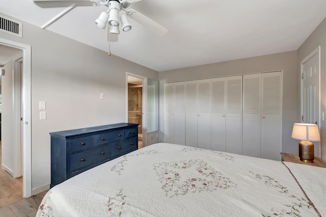 bedroom with light hardwood / wood-style floors, a closet, and ceiling fan