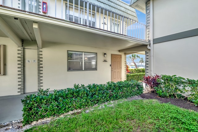 property entrance with a balcony