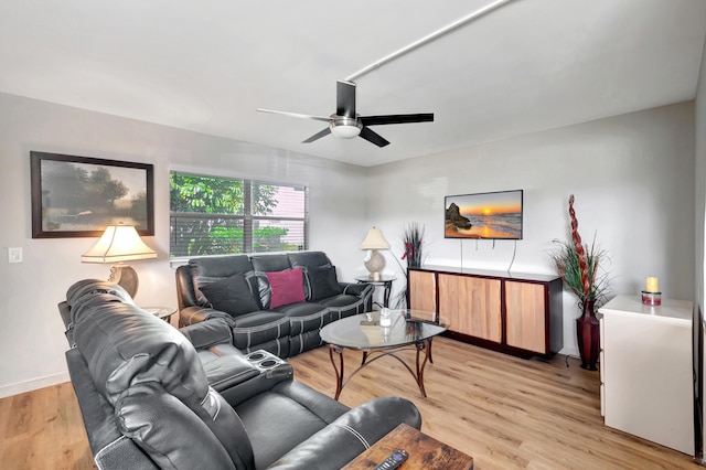 living room with ceiling fan and light wood-type flooring