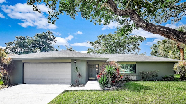 ranch-style house with a front yard and a garage