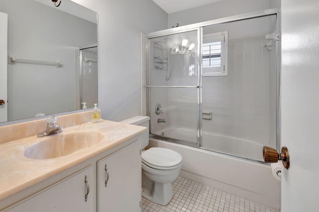 full bathroom with vanity, enclosed tub / shower combo, toilet, and tile patterned floors