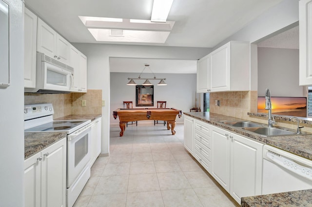 kitchen with white cabinets, billiards, pendant lighting, and white appliances