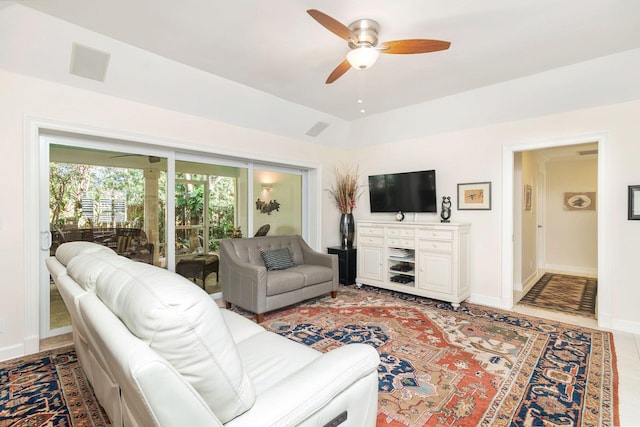 living room featuring ceiling fan and light tile patterned floors