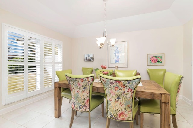 dining space with an inviting chandelier and light tile patterned floors